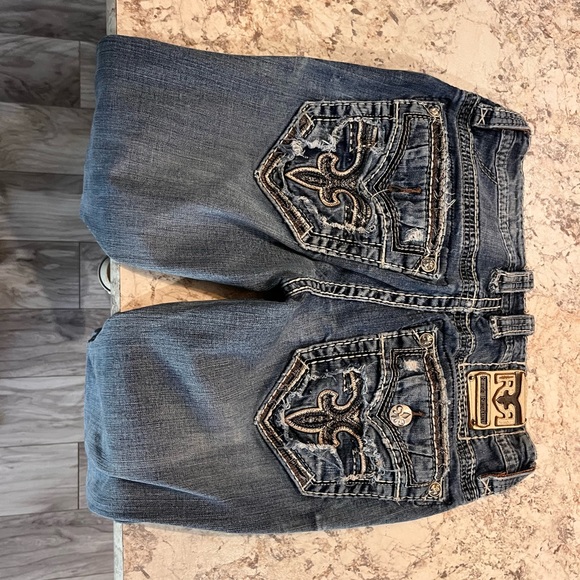 pairs of rock revival jeans all slim boot cut